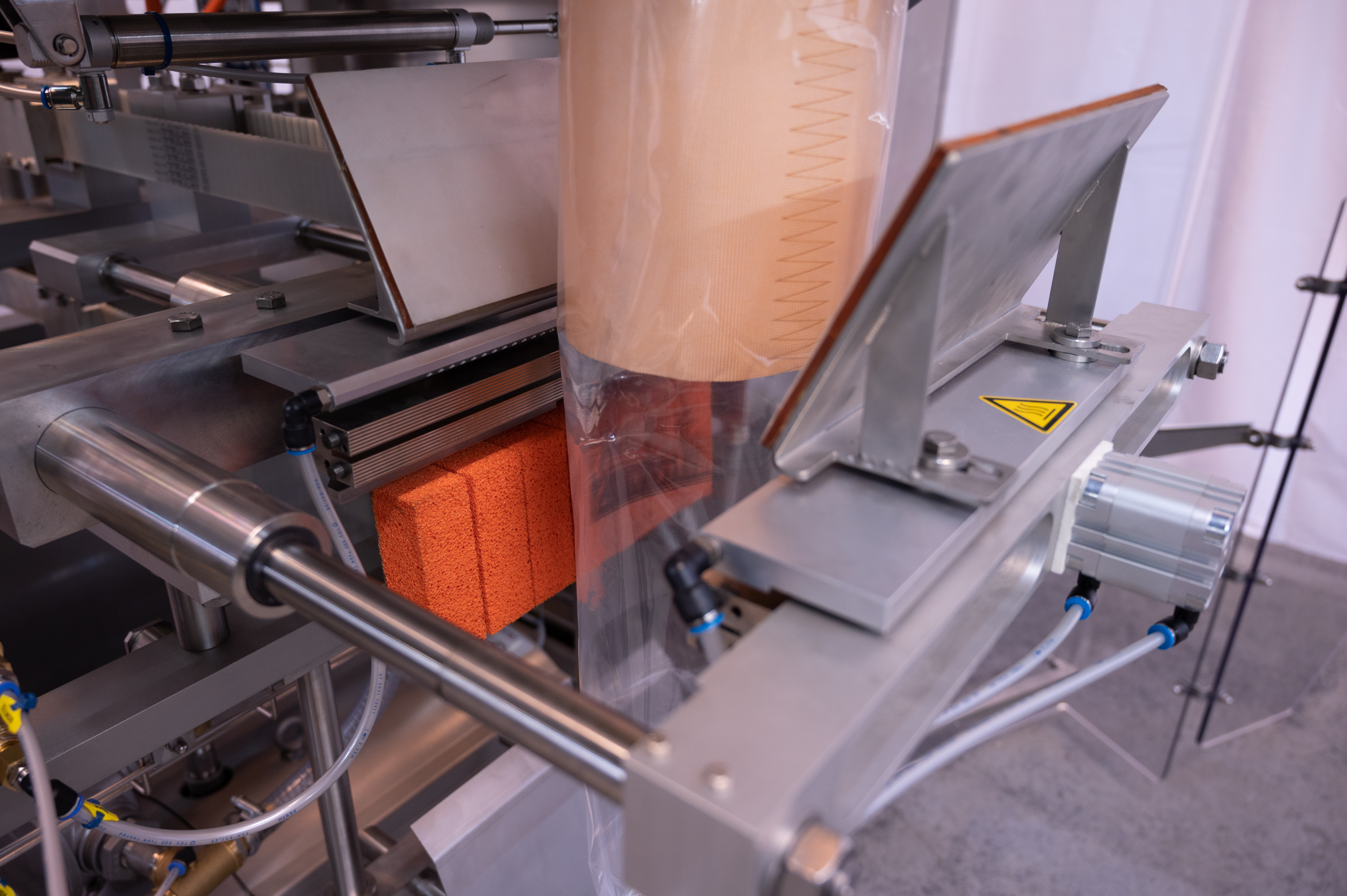 Film formed into a cylinder on the AVN E350 SCD form fill and seal machine